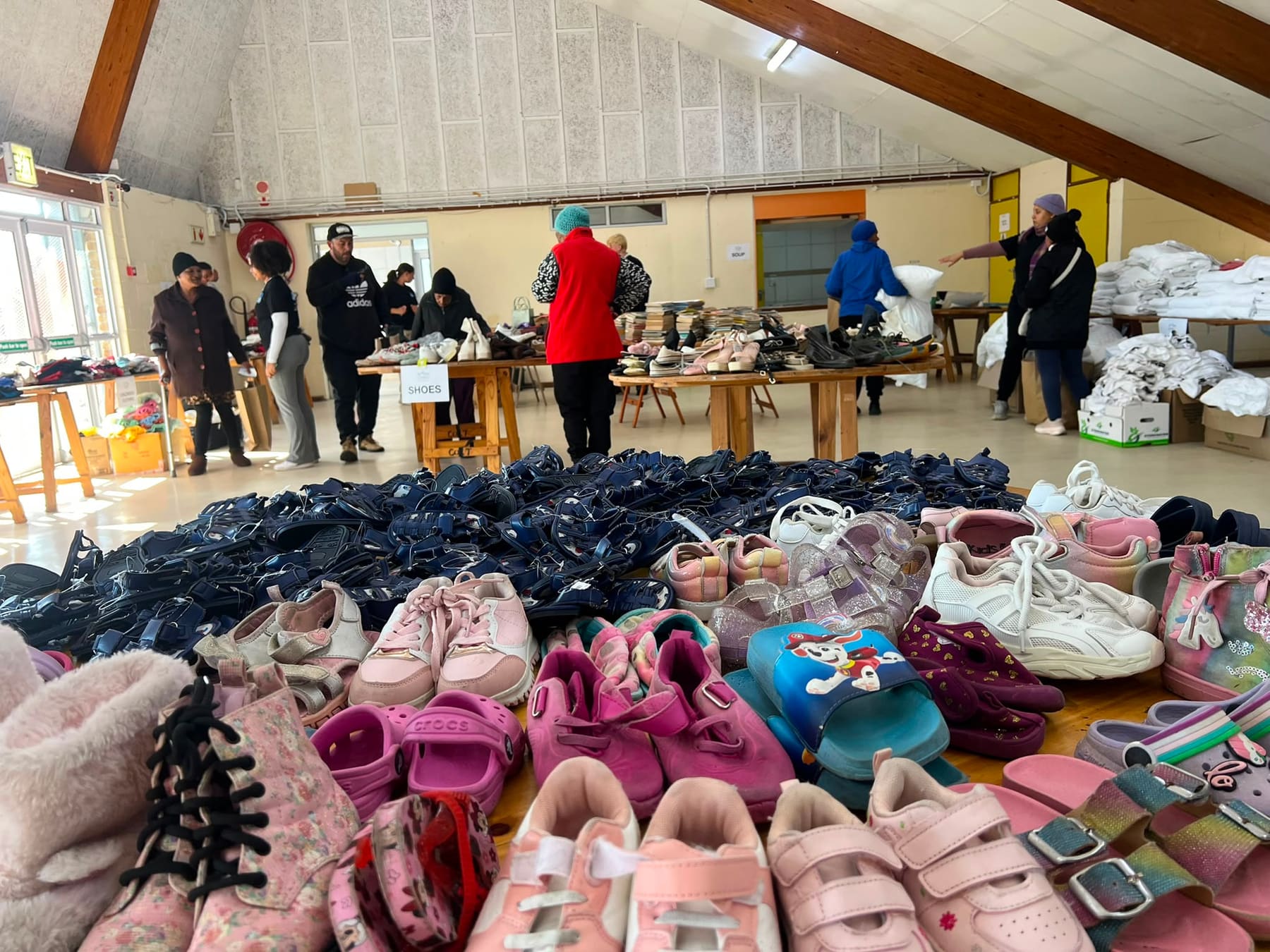 Donated shoes laid out in the community hall